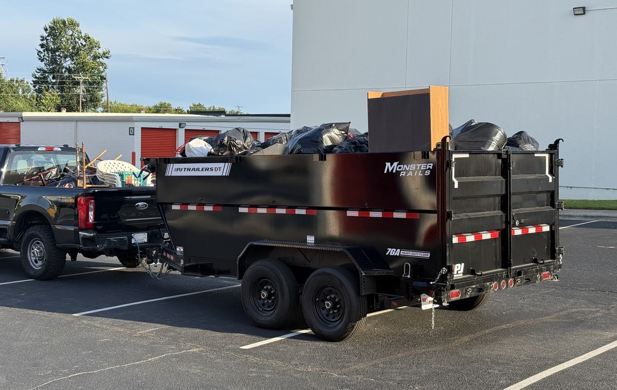 The Haulchemy trailer loaded at the end of a storage unit cleanout