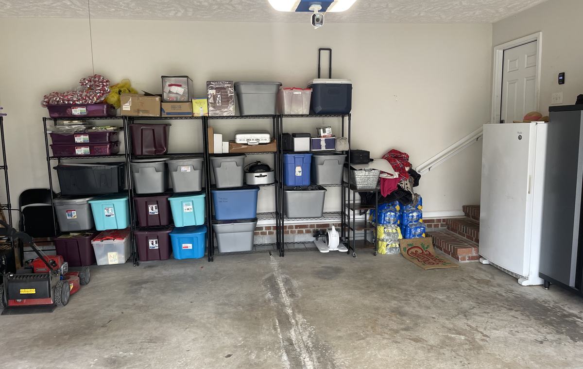 A customer garage with the floor cleared and the shelving left usable