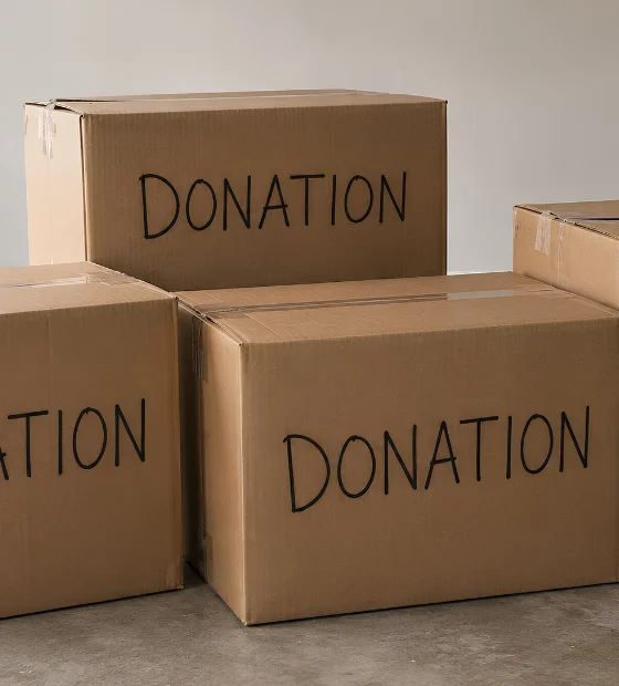 Donation Pickup: cardboard boxes marked DONATION stacked ready for collection