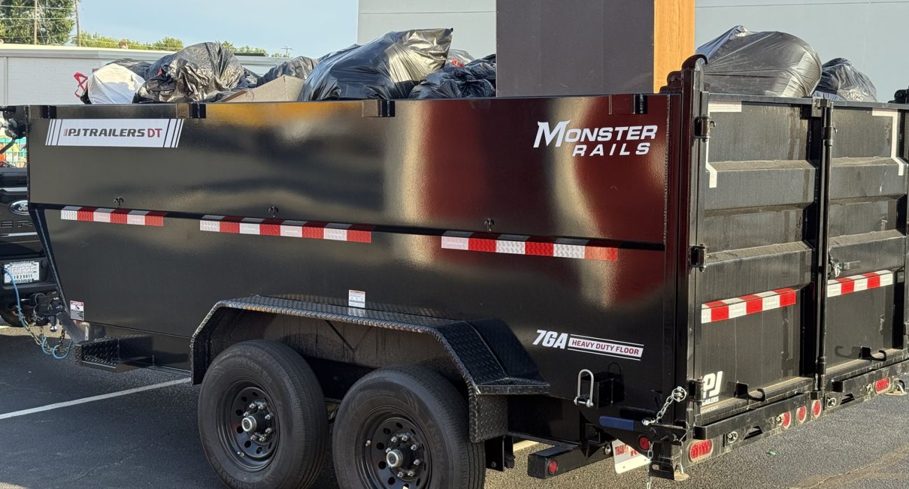 Junk Removal: the Haulchemy dump trailer loaded with a mixed household job